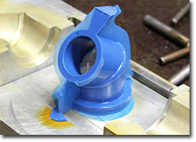 small blue polyurethane part 